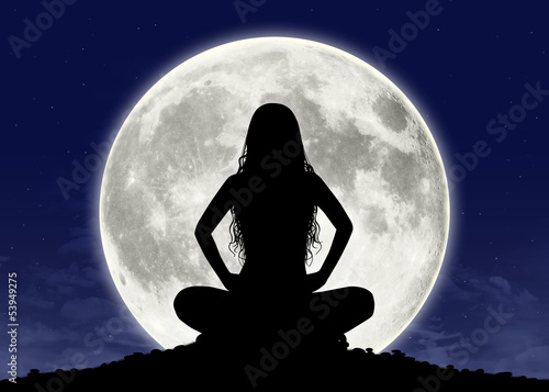 Tela young woman in meditation at the full moon