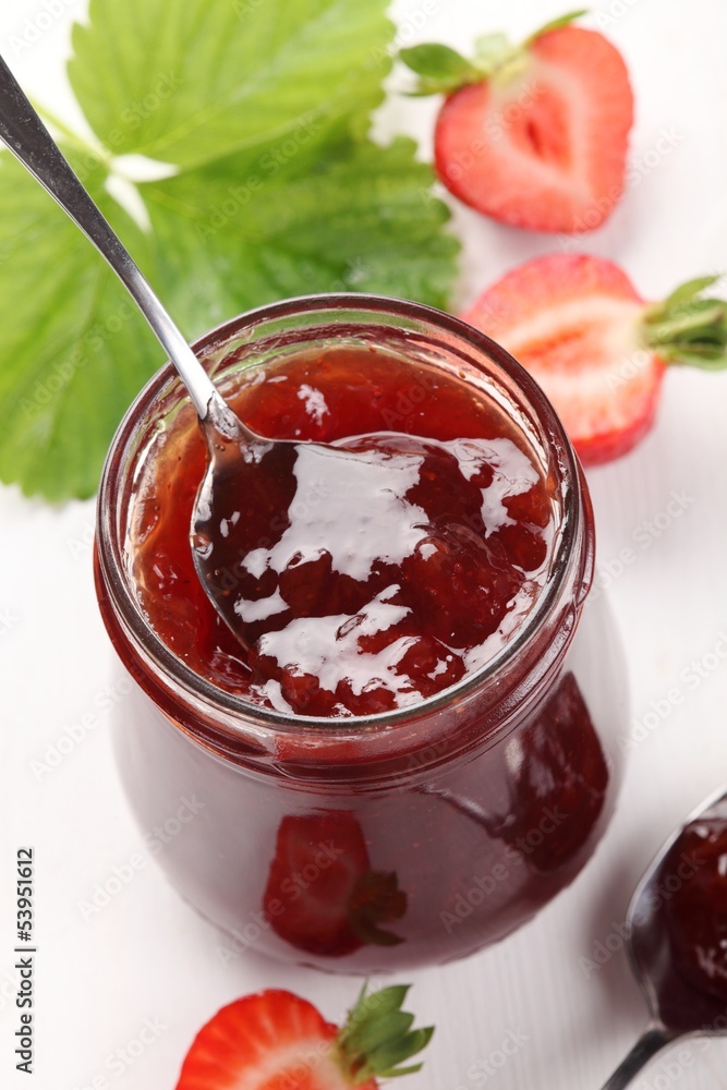 Glass with strawberry jam and fresh strawberries. Glass with strawberry jam and fresh strawberries.