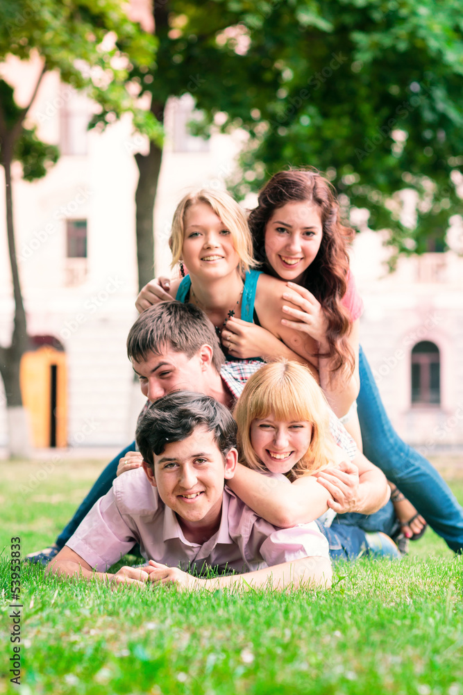 Group of happy smiling Teenage Students Outside Group of happy smiling Teenage Students Outside