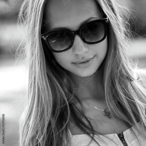 black and white portrait of a beautiful girl with glasses