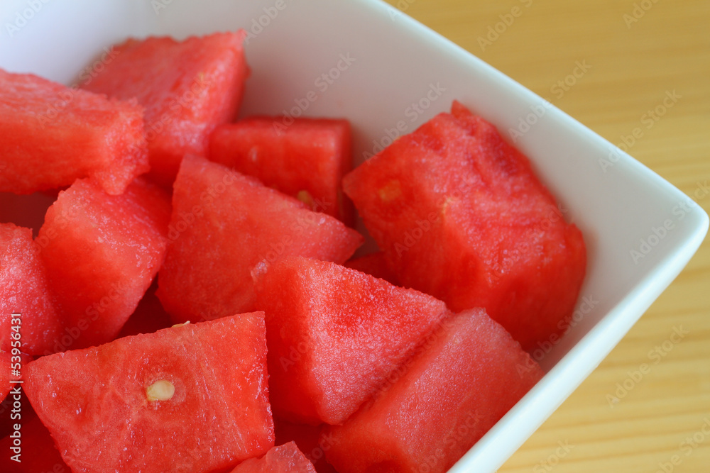Watermelon cubes in white bowl, close up Watermelon cubes in white bowl, close up