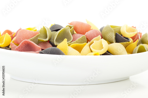 Colourful italian raw noodles waiting to be cooked photo