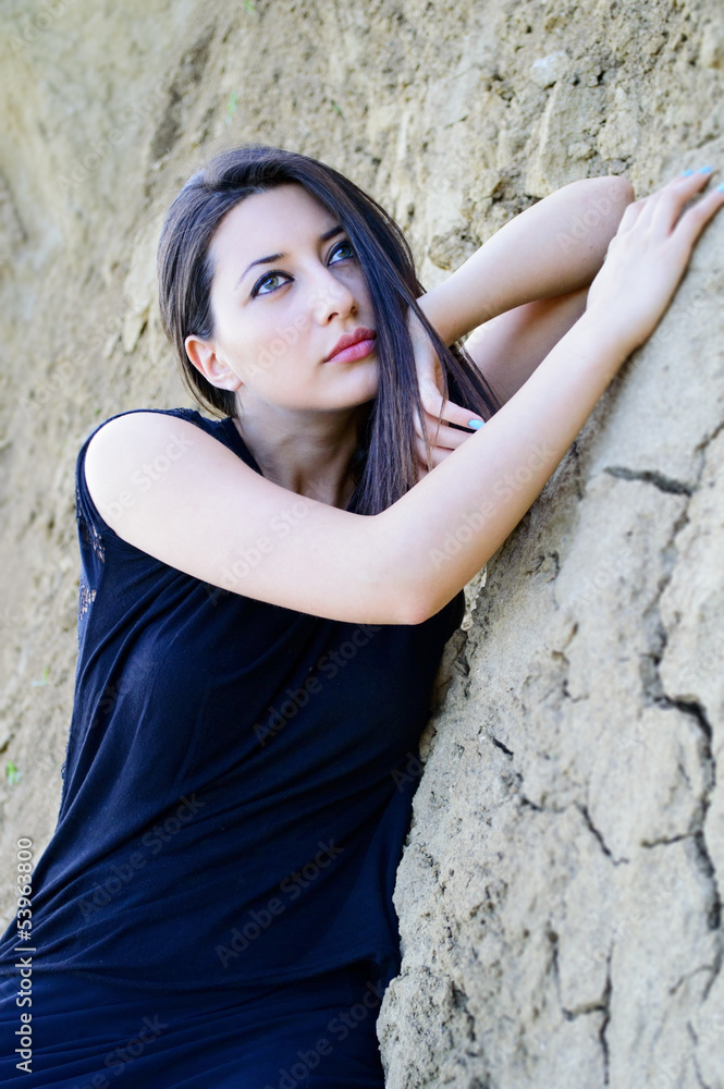 Beautiful young woman with clay background Beautiful young woman with clay background