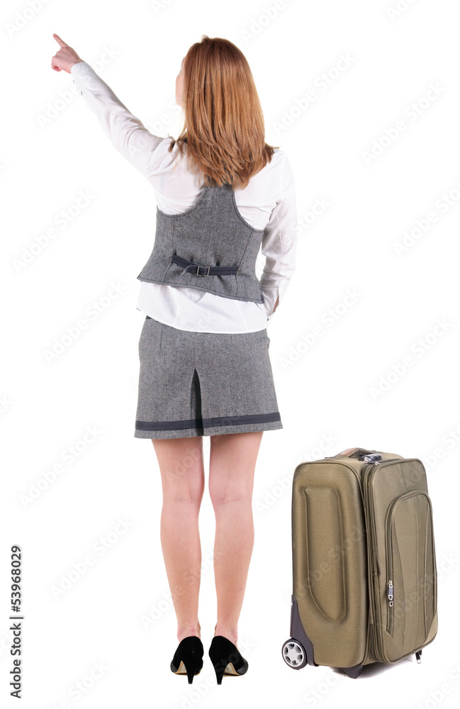 Back view of pointing business woman with suitcase looking up. Back view of pointing business woman with suitcase looking up.