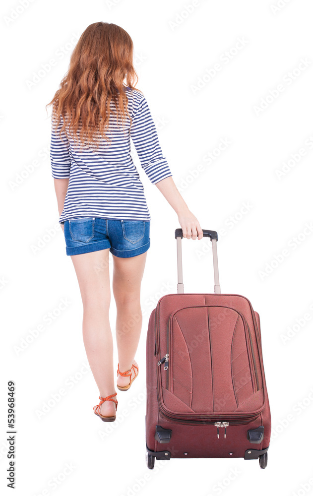 back view of walking woman with suitcase back view of walking woman with suitcase