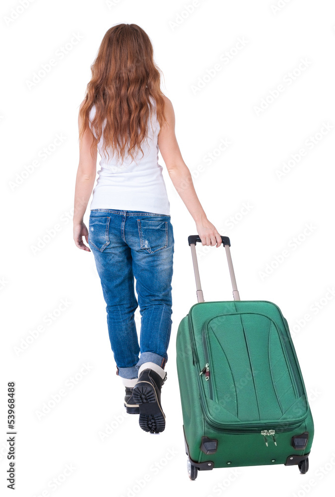 back view of walking woman with suitcase back view of walking woman with suitcase