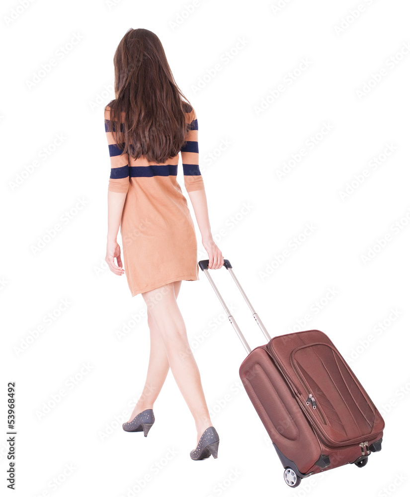 back view of walking woman with suitcase back view of walking woman with suitcase