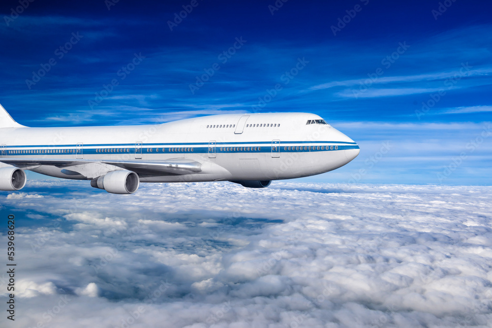passenger airplane in the clouds. passenger airplane in the clouds.