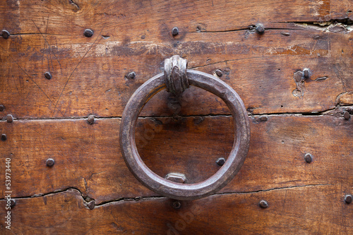 Fototapeta Naklejka Na Ścianę i Meble -  Antique door knocker, Tuscany, Italy