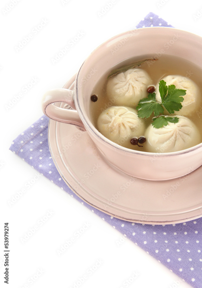 Tasty khinkali in .saucepan, isolated on white Tasty khinkali in .saucepan, isolated on white