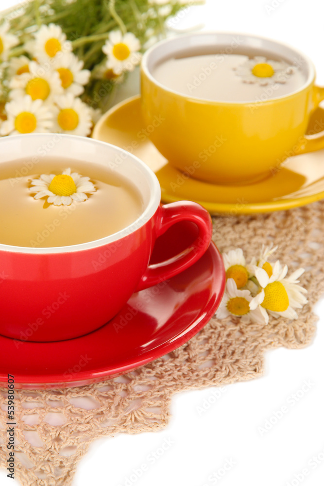Cups of herbal tea with camomiles close up Cups of herbal tea with camomiles close up