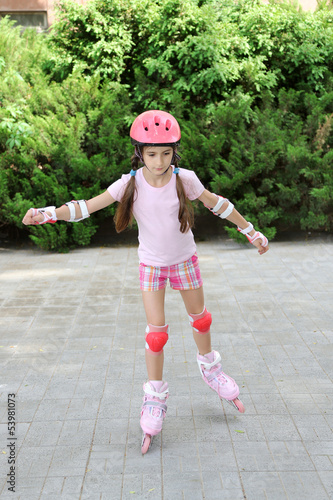 Little girl in roller skate...
