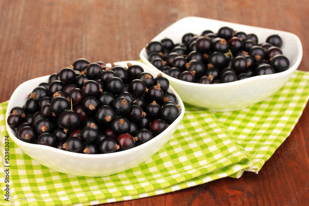 Fresh black currant on wooden background Fresh black currant on wooden background