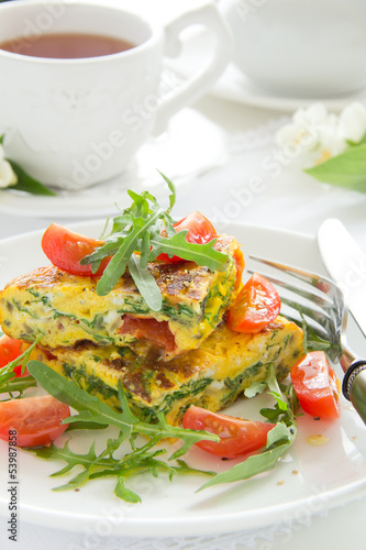 Omelet (Frittata) with tomatoes and herbs.