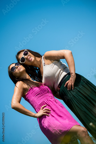 two girls in dress having fun © Jale Ibrak