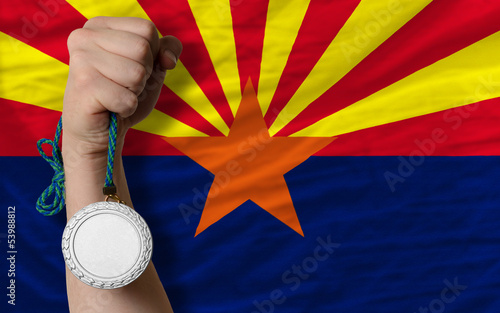 Silver medal for sport and  flag of american state of arizona photo