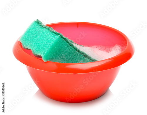 Canvas Print Red bowl and green sponge with foam