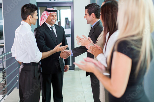 translator introducing arabian businessman photo