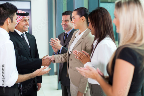 Εκτύπωση καμβά young translator introducing arab businessman