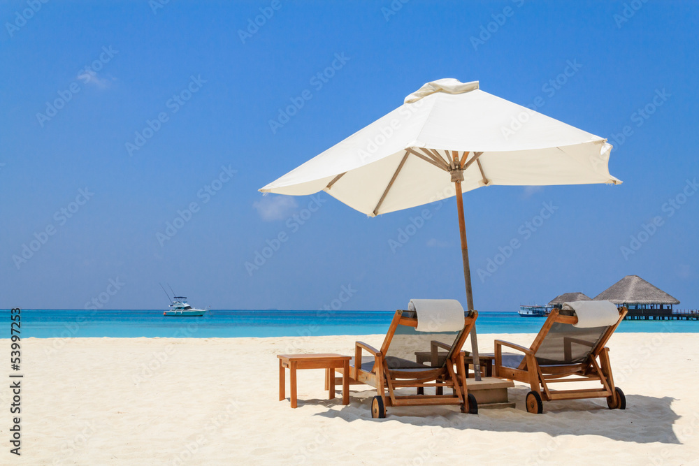 Scenery of the beach with a white parasol