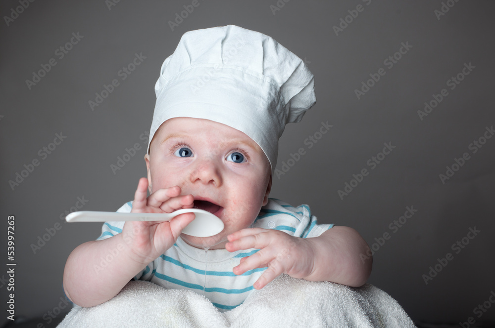 little chef with spoon in hand and hat little chef with spoon in hand and hat