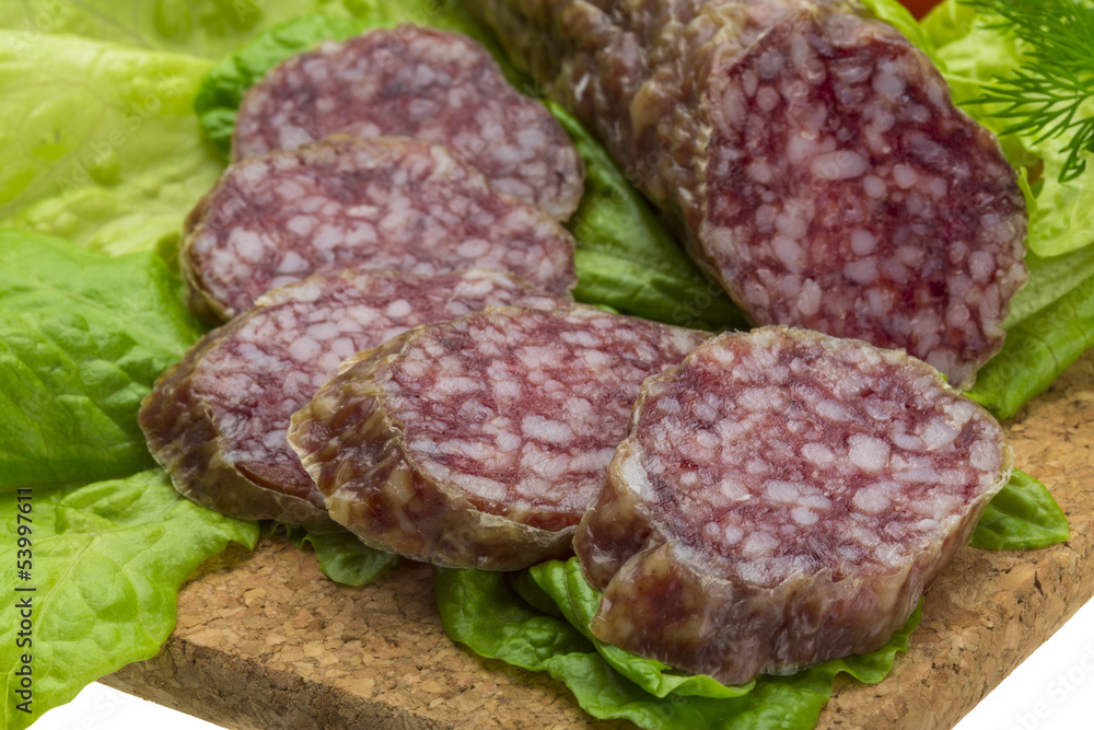 Salami with rosemary, salad and tomatoes Salami with rosemary, salad and tomatoes