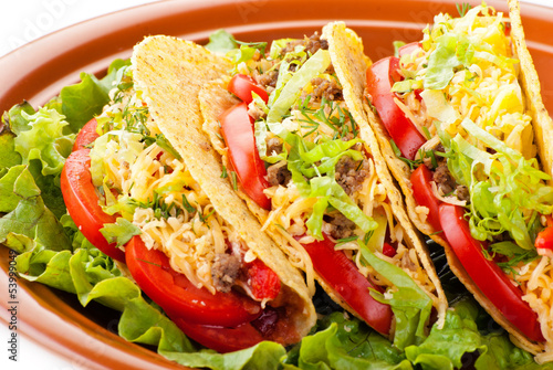 beef tacos with salad and tomatoes salsa