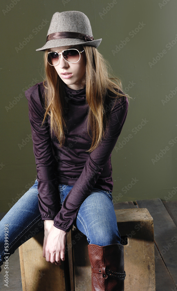 beautiful fashion woman in cap sitting chair beautiful fashion woman in cap sitting chair