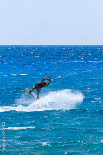 young kiter in the turquoise sea