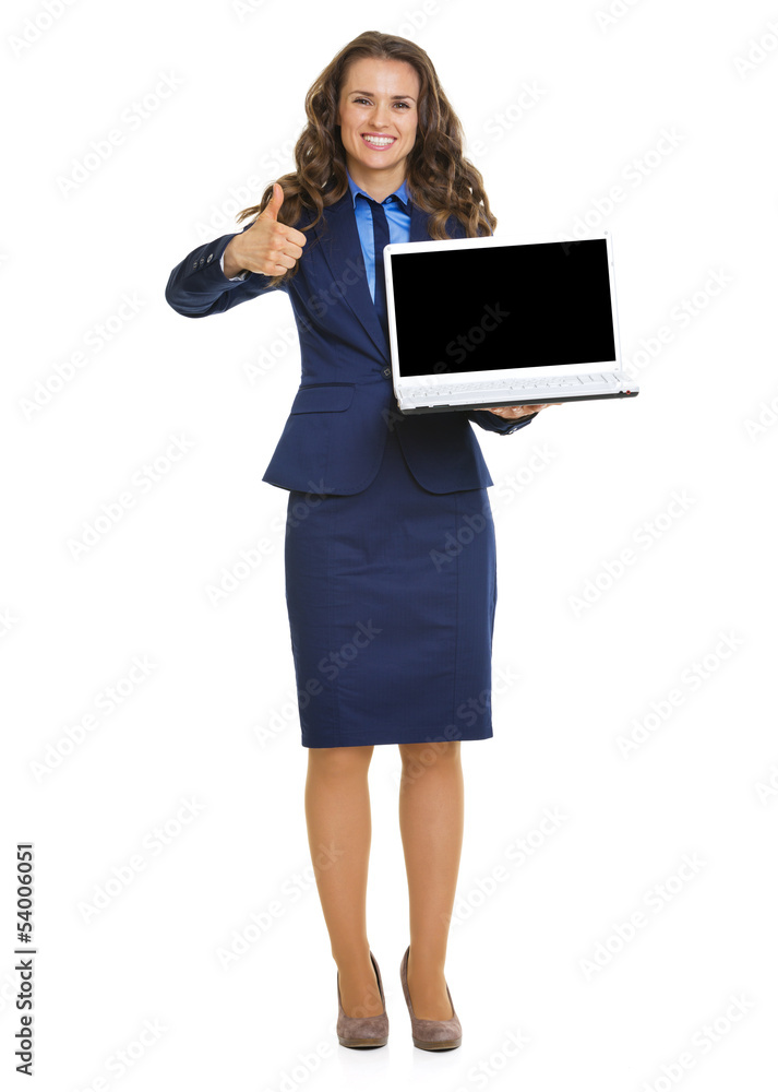 Happy business woman showing laptop blank screen and thumbs up Happy business woman showing laptop blank screen and thumbs up