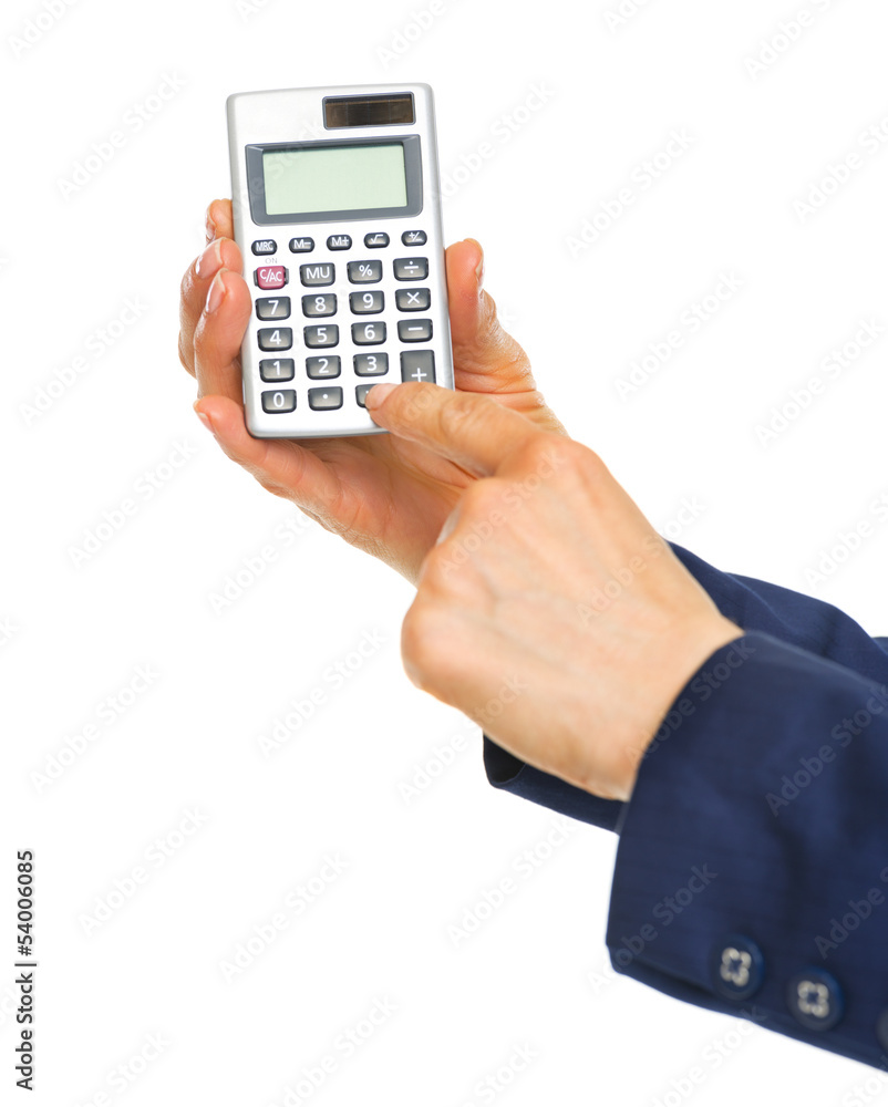 Closeup on business woman hands using calculator Closeup on business woman hands using calculator