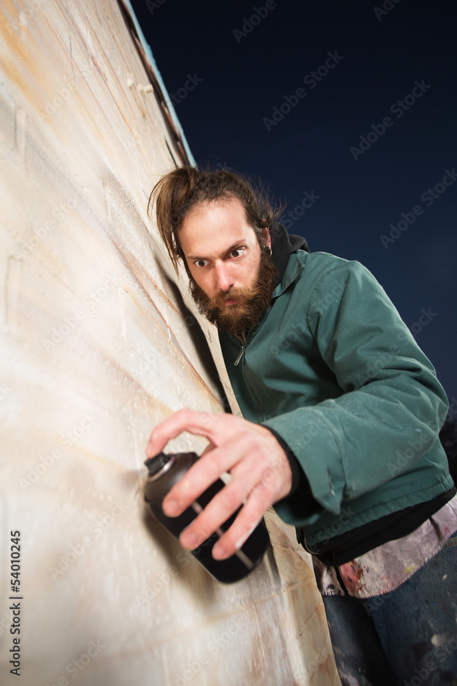 Serious Bearded Man Spray Painting