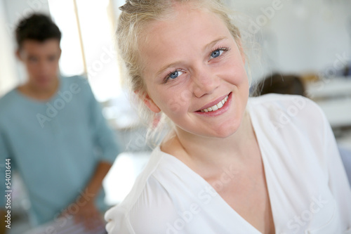 Portrait of smiling student girl in sewing class