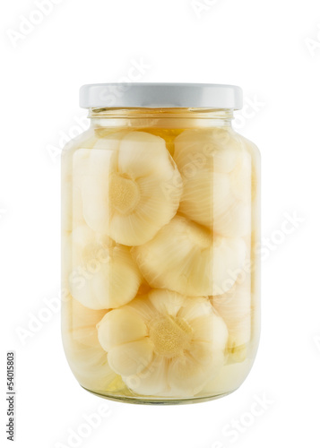 Seasoning pickled garlic in glass jar