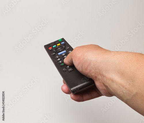 Wallpaper Mural hand with the TV remote control Torontodigital.ca