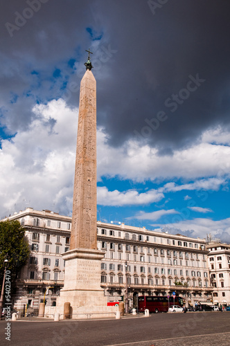Obelisk at Piazza di Laterano with stormy sky at Rome