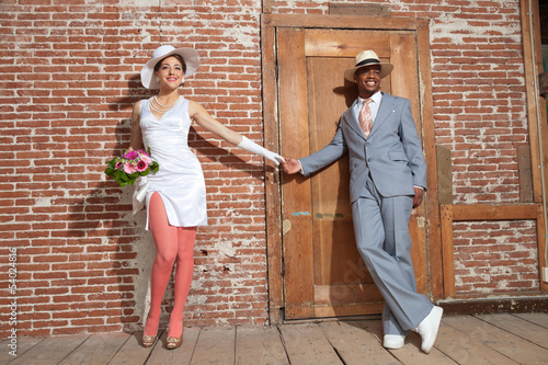 Canvas Print Vintage jazz fashion sexy wedding couple in old urban building.