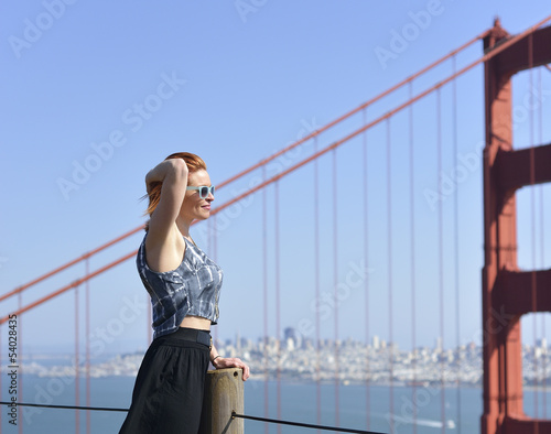 Woman posing with golden gate bridge