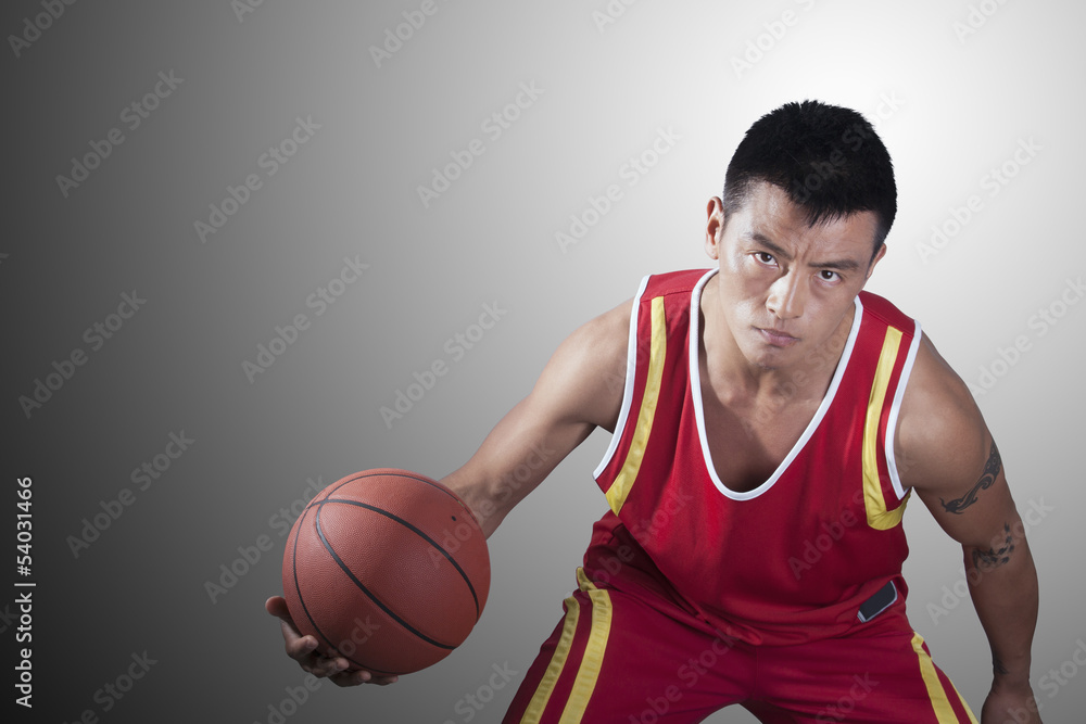Portrait of young man holding a basketball Portrait of young man holding a basketball