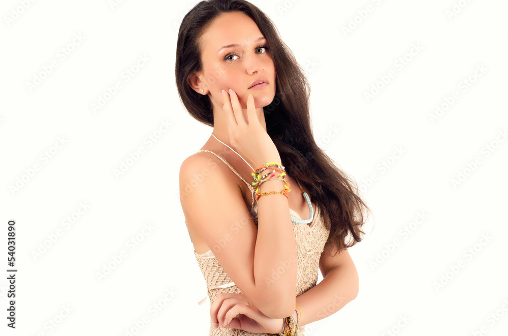 Fototapeta premium Beautiful brunette woman in a dress posing fashion in studio