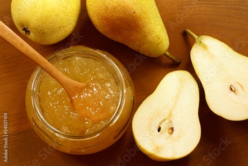 Pear jam in glass and pears.