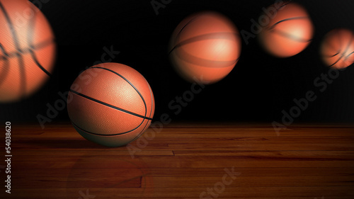 basketball bouncing on wood floor