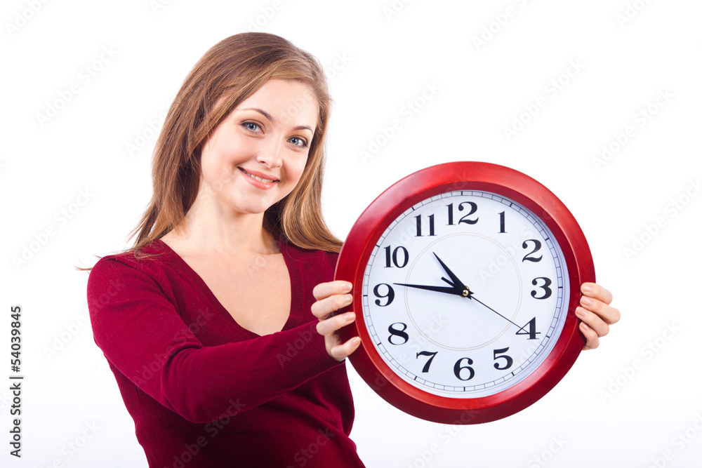 young smiling woman isolated on white background holding a clock young smiling woman isolated on white background holding a clock