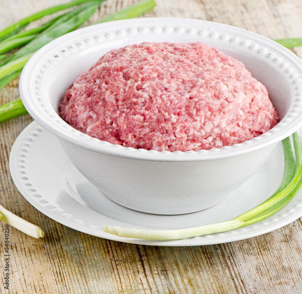 minced meat on a wooden table minced meat on a wooden table