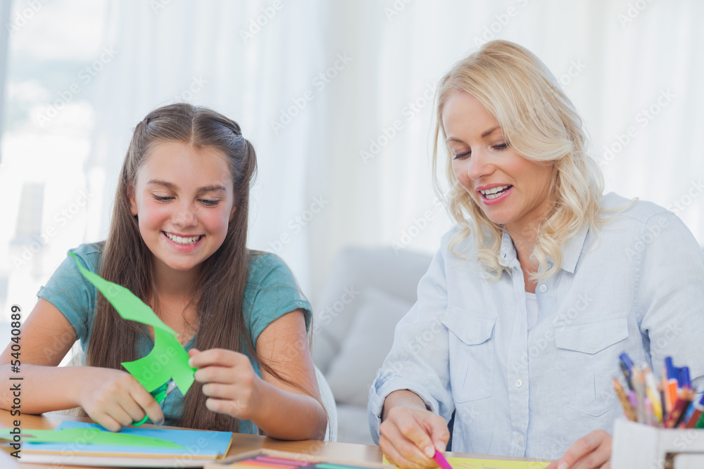 Mother and daughter doing arts and crafts together Mother and daughter doing arts and crafts together