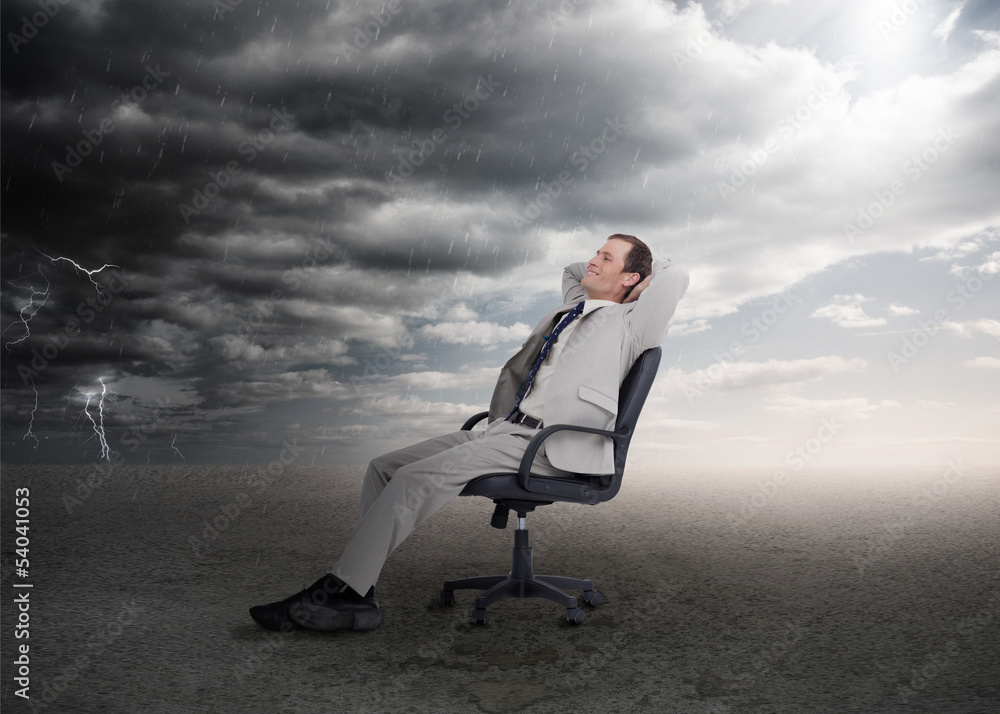 Attractive businessman sitting on a swivel chair Attractive businessman sitting on a swivel chair