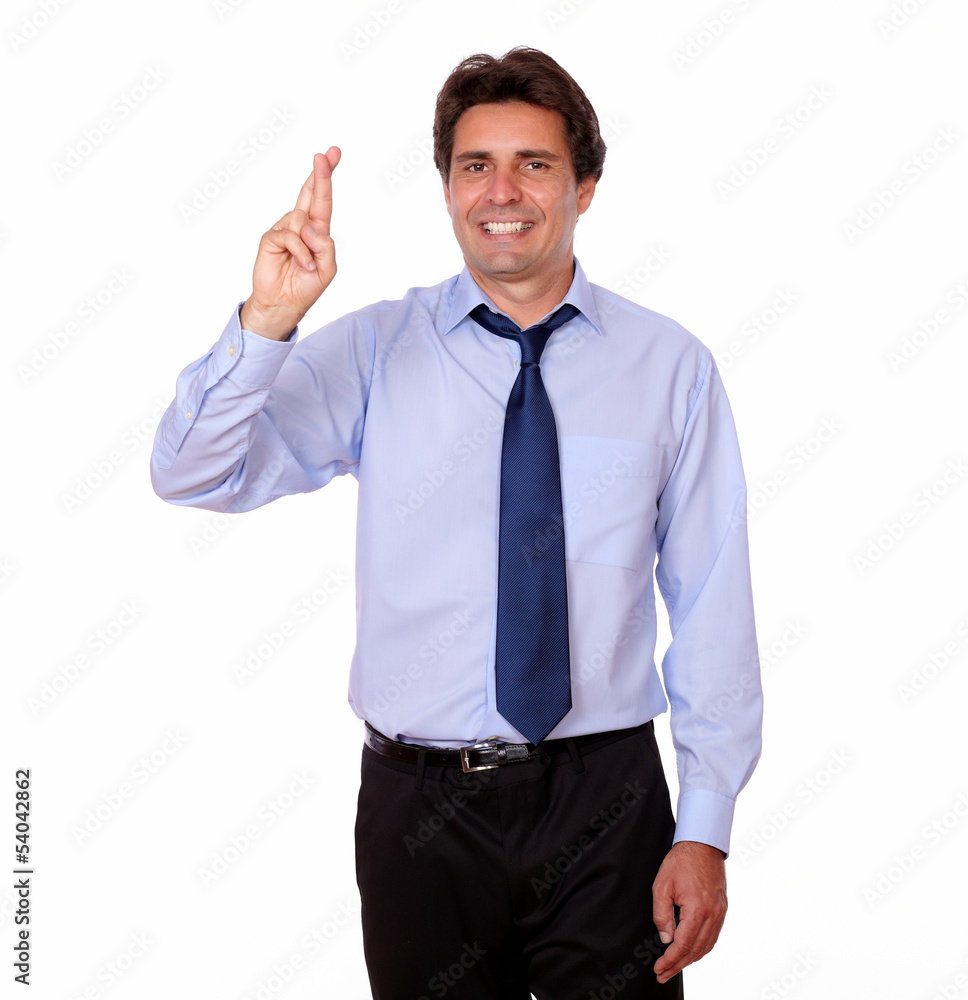 Handsome man crossing his fingers for luck Handsome man crossing his fingers for luck