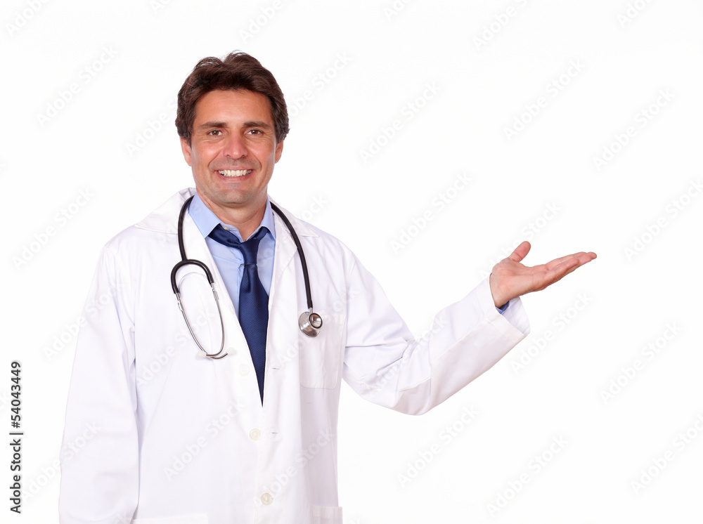Handsome medical doctor holding out his palm Handsome medical doctor holding out his palm
