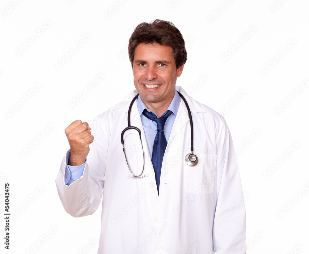 Positive medical doctor standing in white uniform