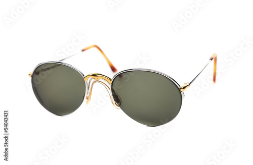 Gold sunglasses on a white.